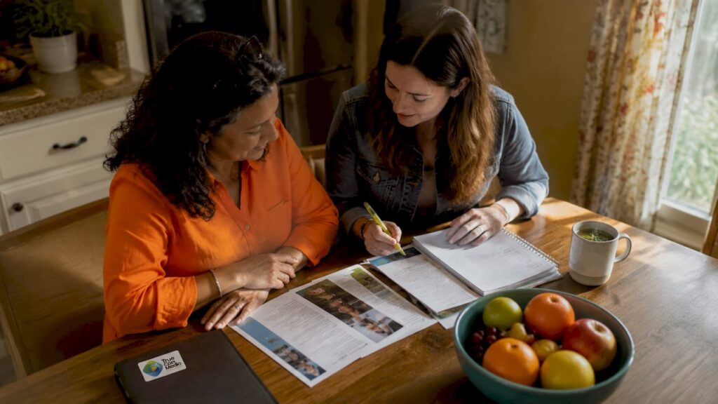 Family reviewing disability service testimonials
