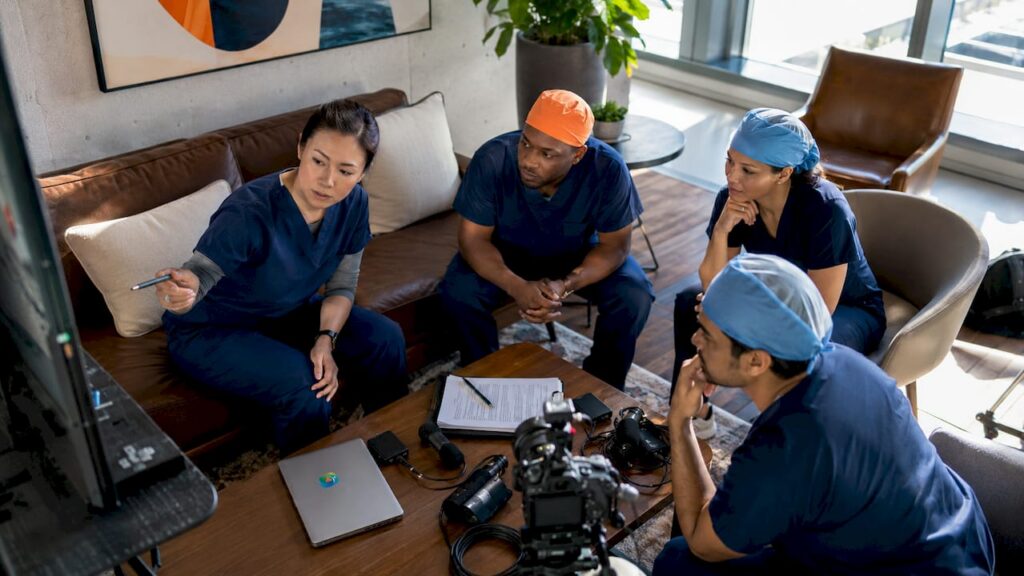Surgical team preparing video production setup
